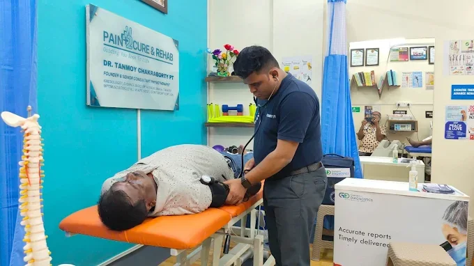 Dr. Tanmoy Chakraborty treating a patient at the clinic