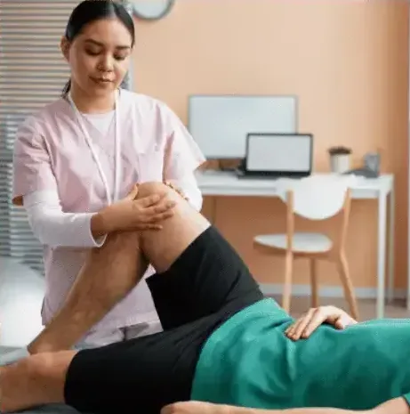 Therapist assessing a patient's knee range of motion